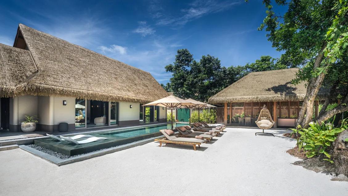 The Three Bedroom Beach Residence with Pool, its long pool running between the main pavilion and a second thatched-roof lounge