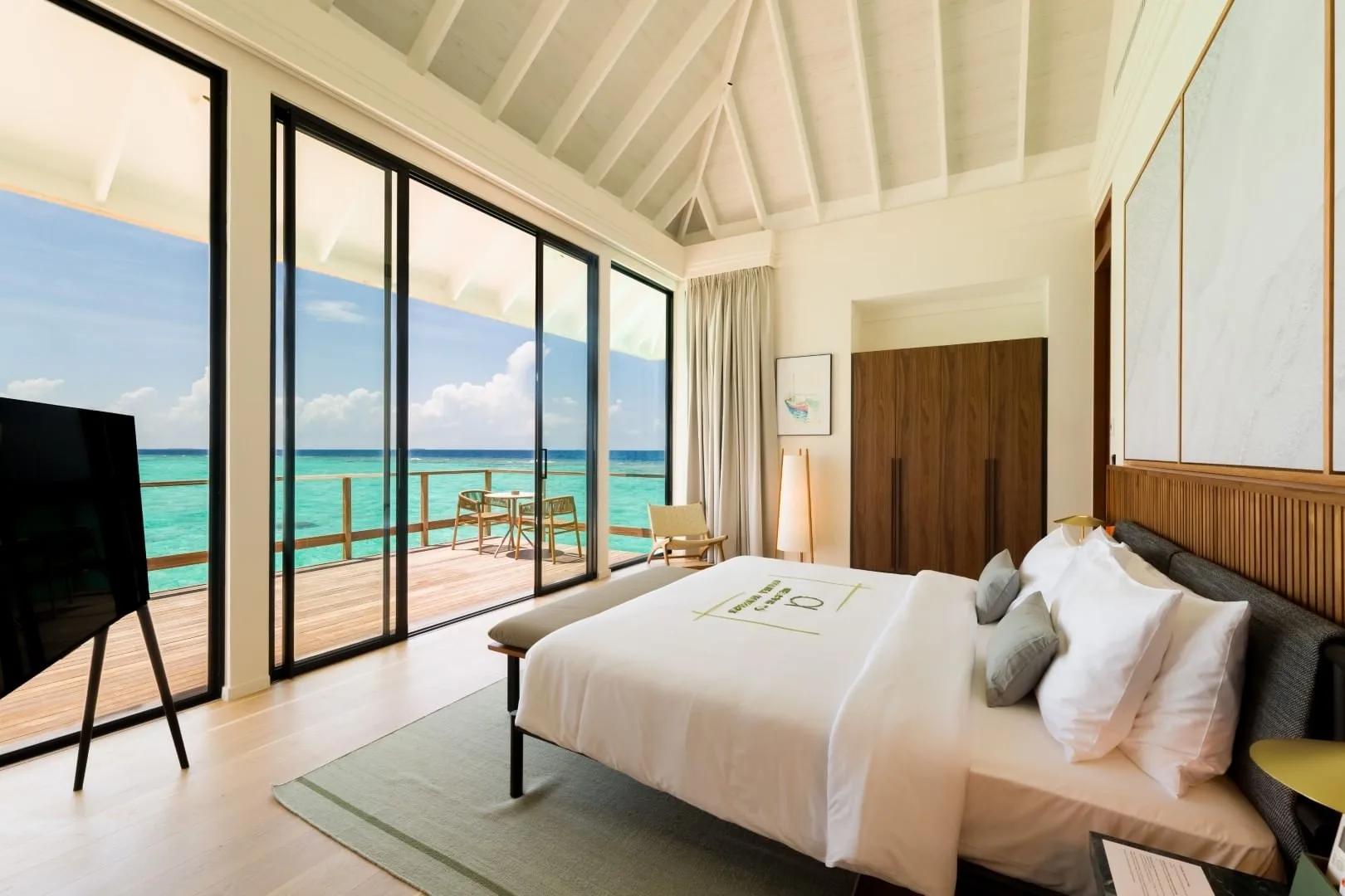 An overwater bedroom with sea view, representative of the 3-Bedroom Water Residence category