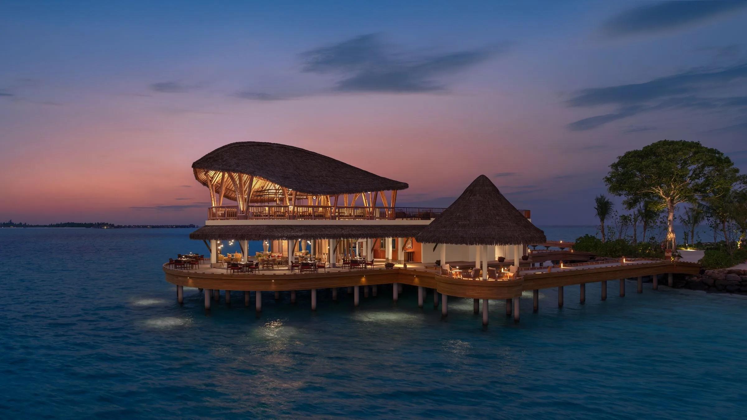 Nikkei's overwater seating area at dusk