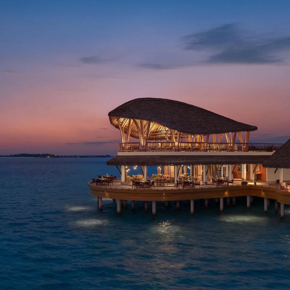 Nikkei's overwater seating area at dusk