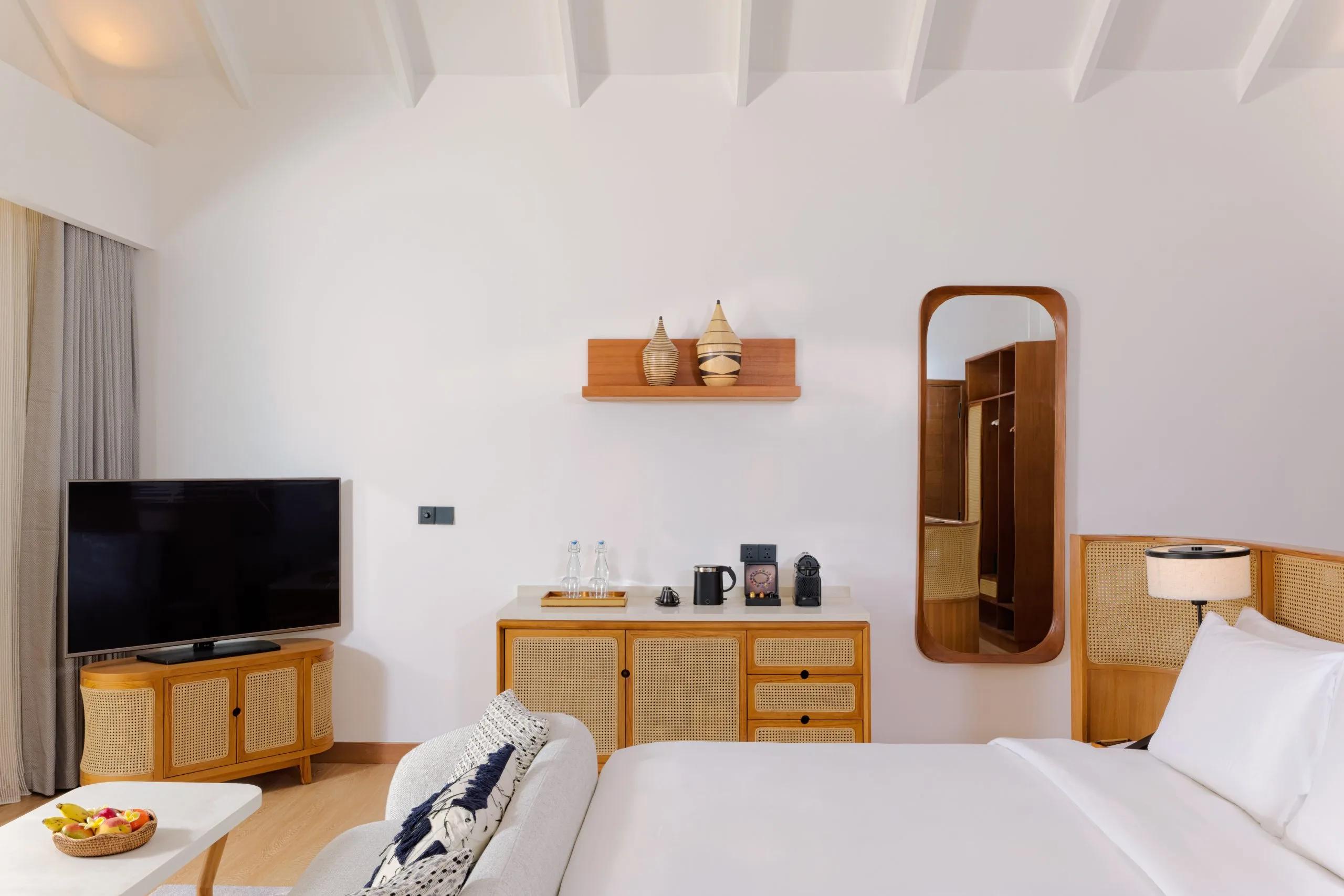 The king bedroom of a Beach Villa at dusitD2 Feydhoo Maldives
