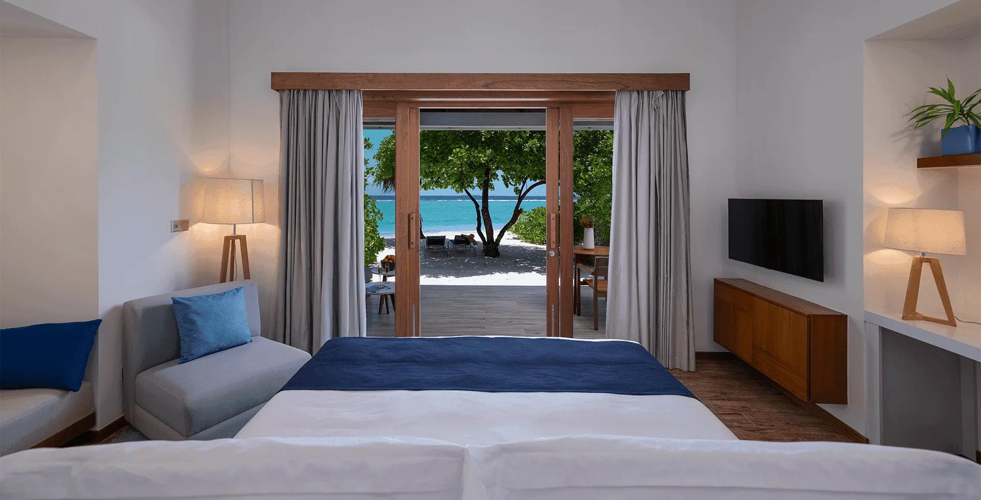The bedroom of a Sunset Beach Villa at Ifuru Island Maldives