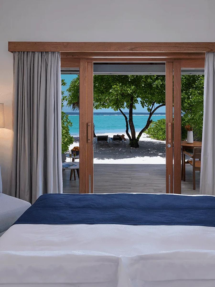 The bedroom of a Sunset Beach Villa at Ifuru Island Maldives