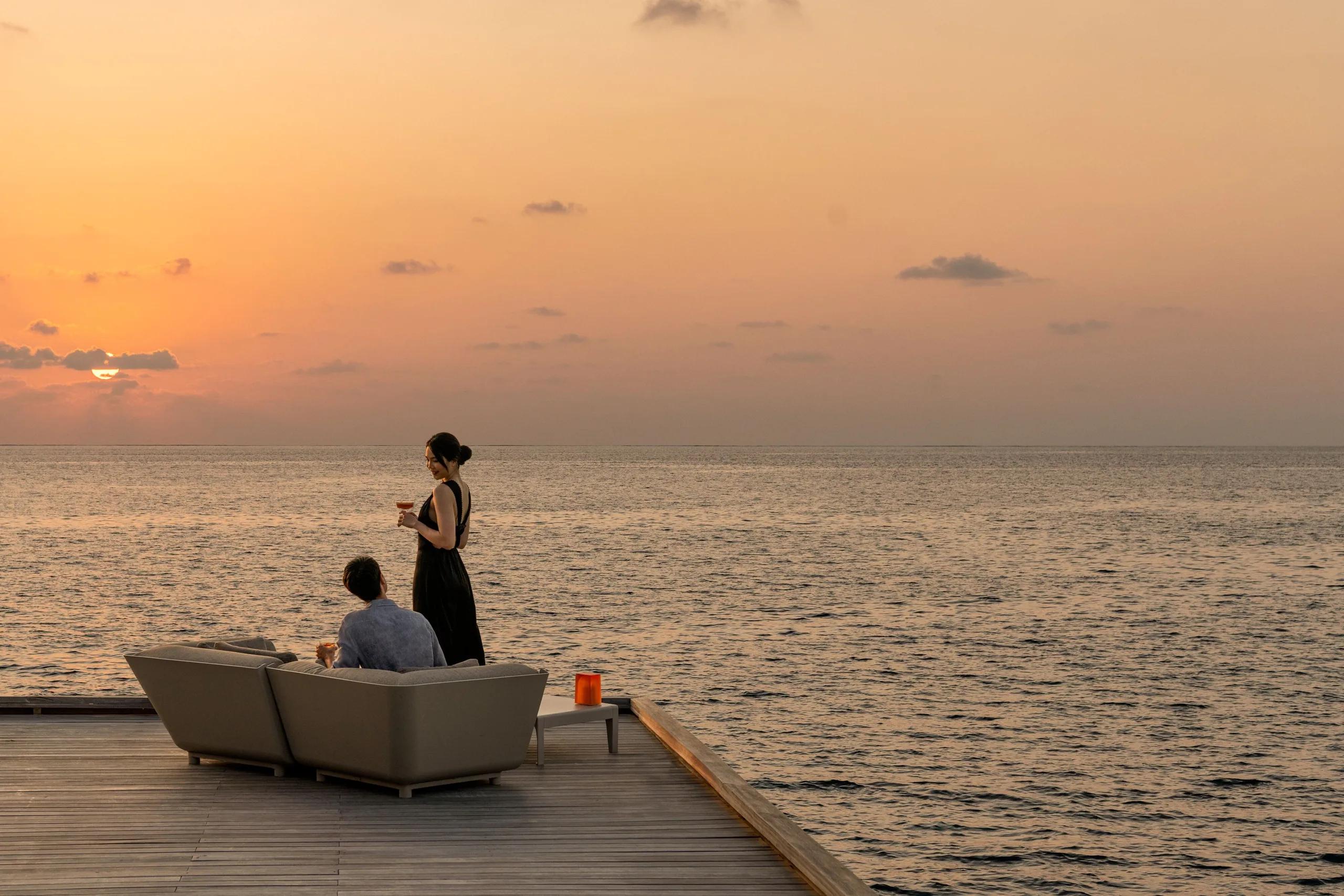 The overwater deck of The Whale Bar at sunset
