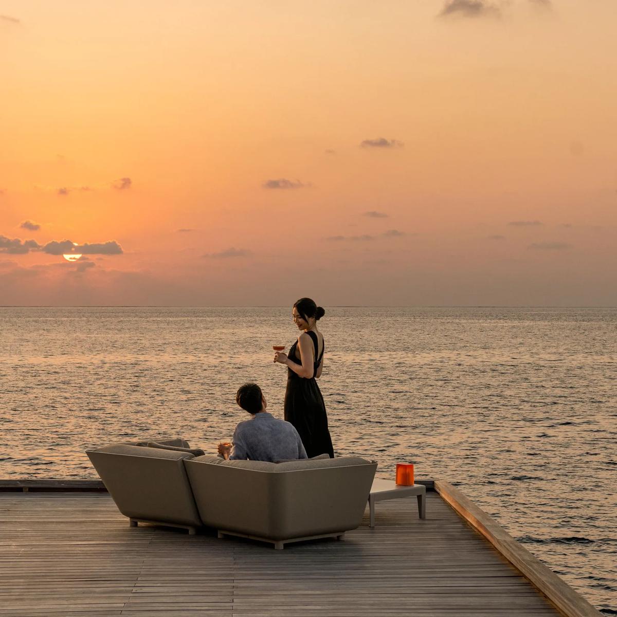 The overwater deck of The Whale Bar at sunset