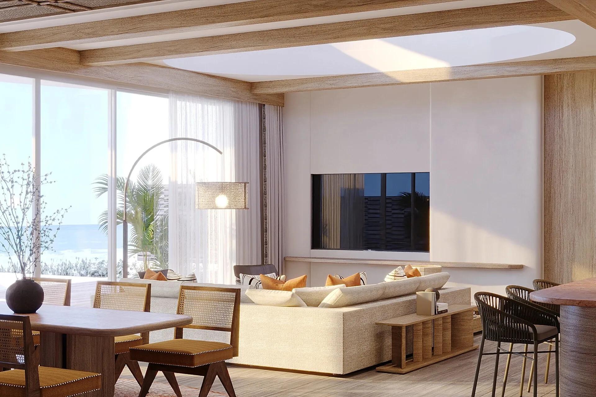 An open-plan living room in a Two Bedroom Water Residence, floor-to-ceiling windows facing the sea