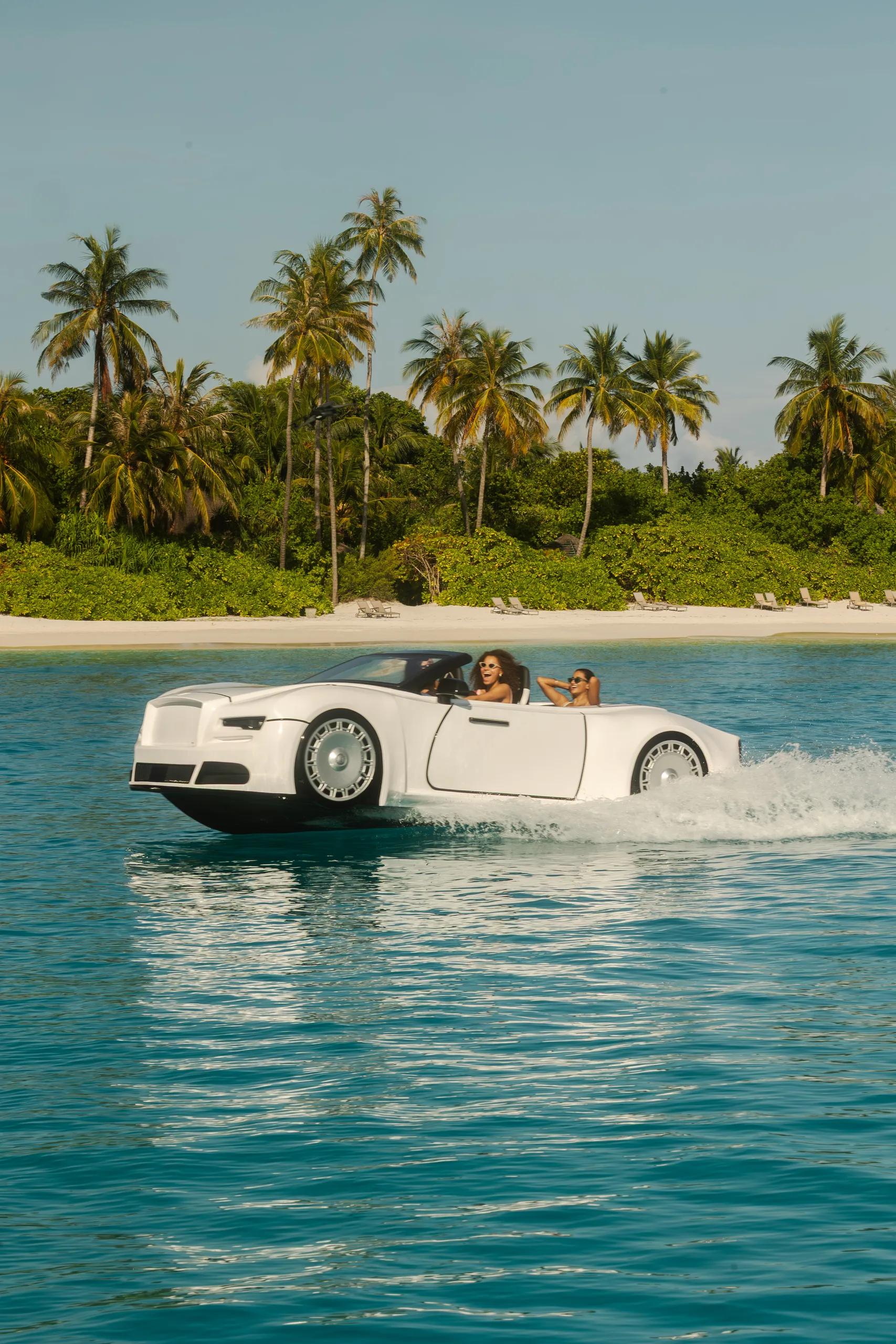 A guest riding a jet car across the lagoon at Sun Siyam Olhuveli