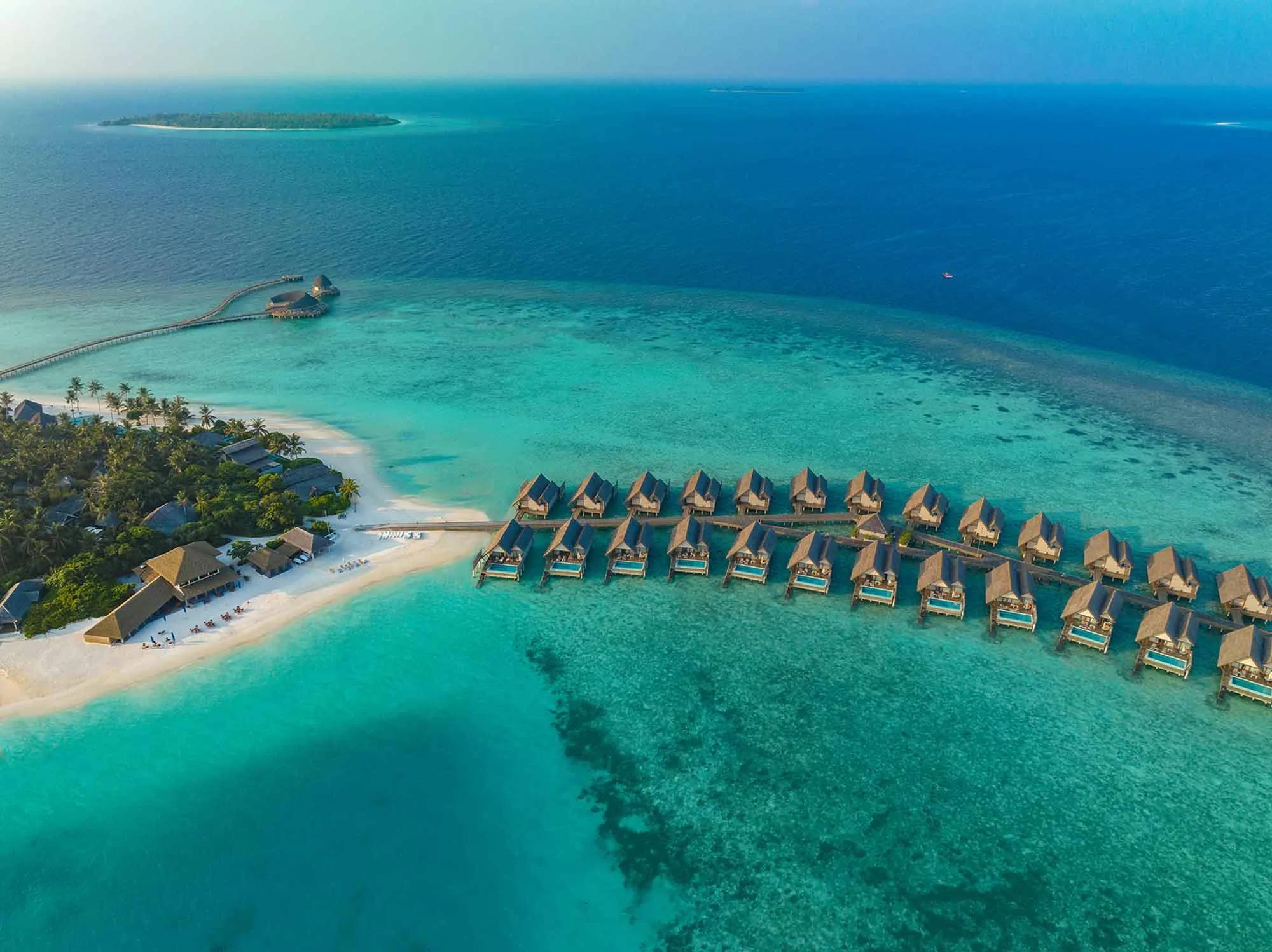 A Water Villa with Pool's overwater deck and plunge pool, on the sunrise-facing jetty
