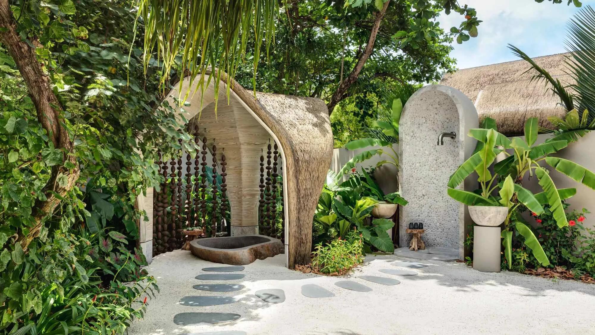 The outdoor shower of a Grand Beach Pool Villa at Joali Being — the Two Bedroom Wellbeing Beach Pool Residence has no dedicated published photo, so its closest sibling category stands in here