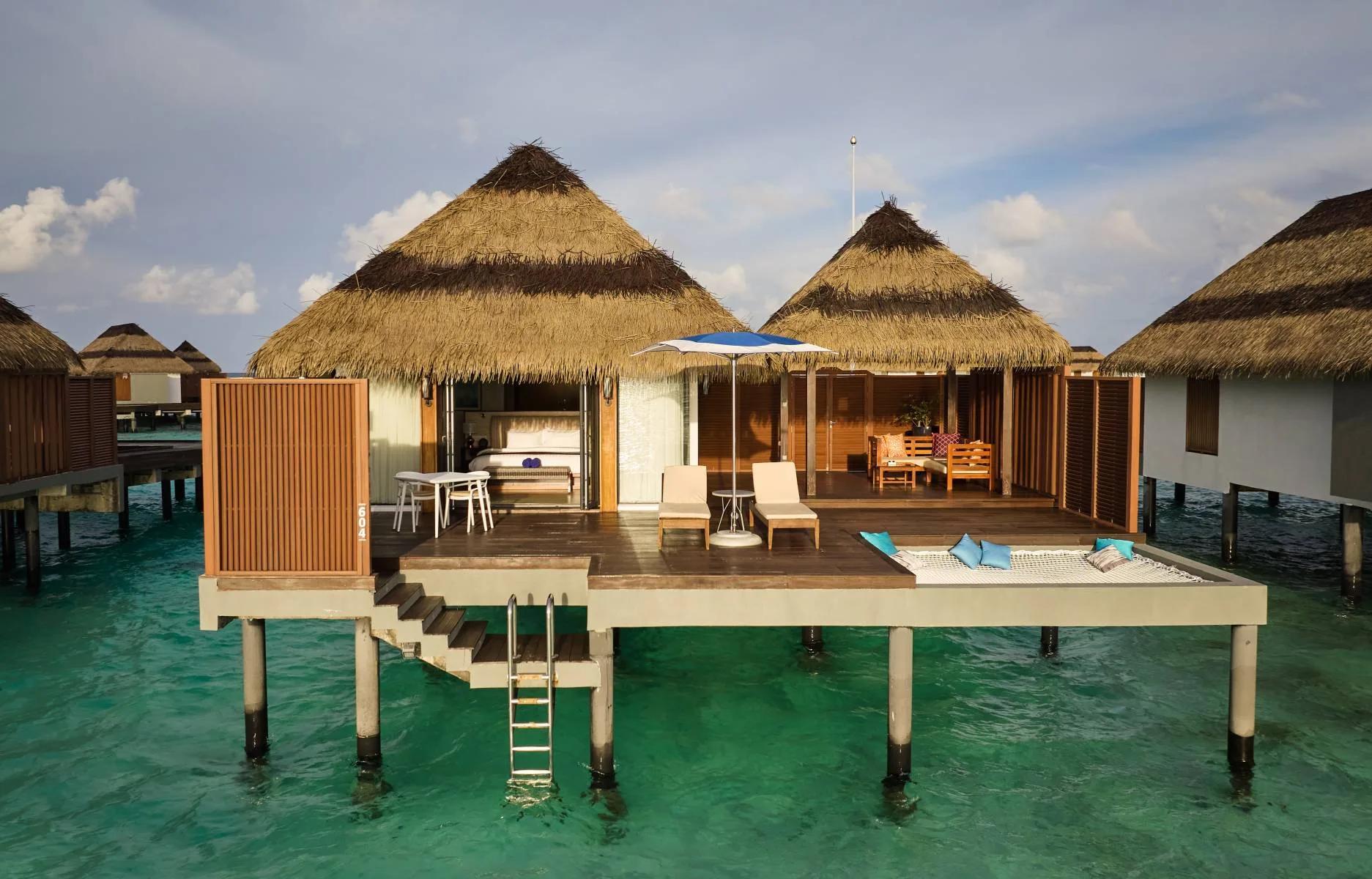 An overwater Ocean Villa extending from the island over the lagoon
