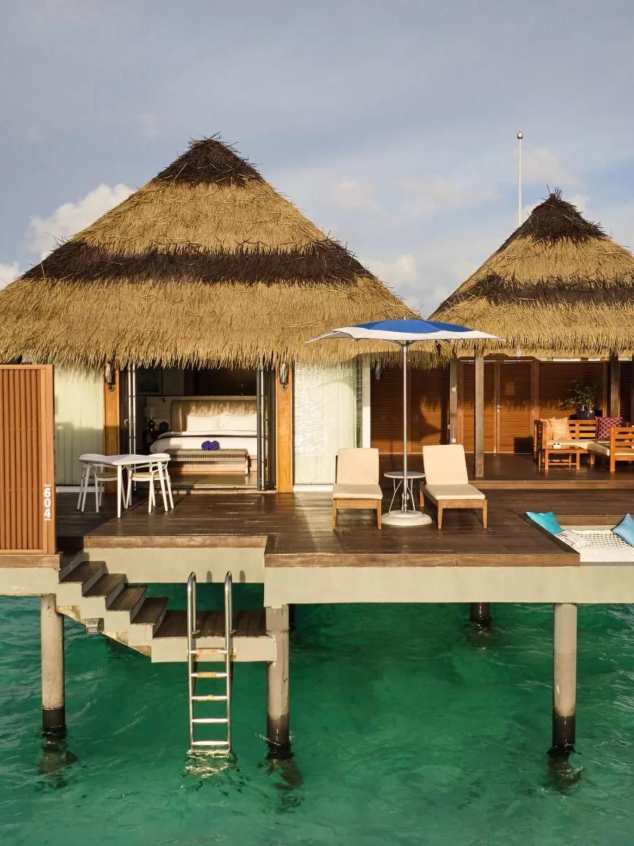 An overwater Ocean Villa extending from the island over the lagoon