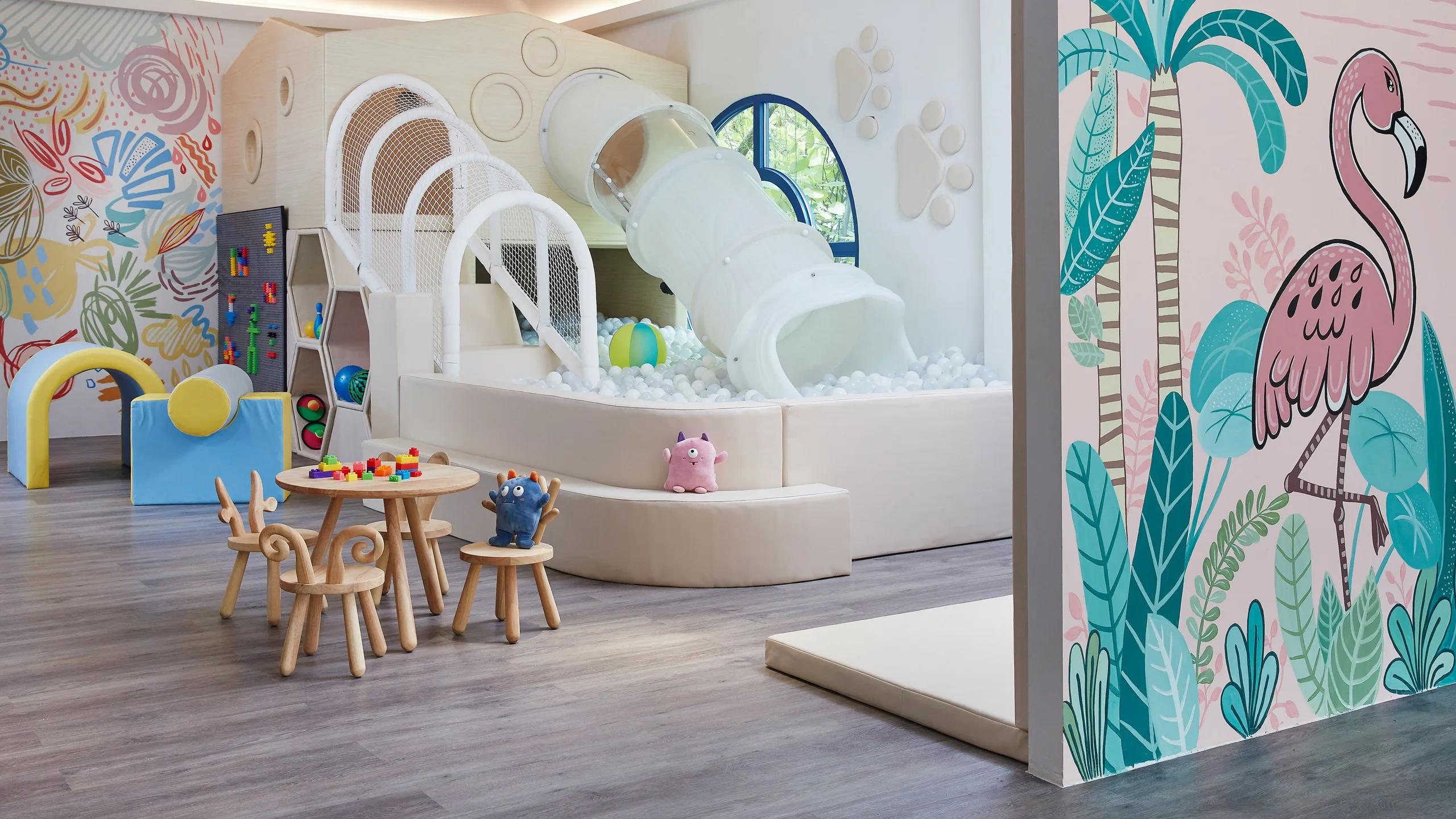 The play area at Le Méridien Family Kids Hub, with a slide, ball pit and climbing wall