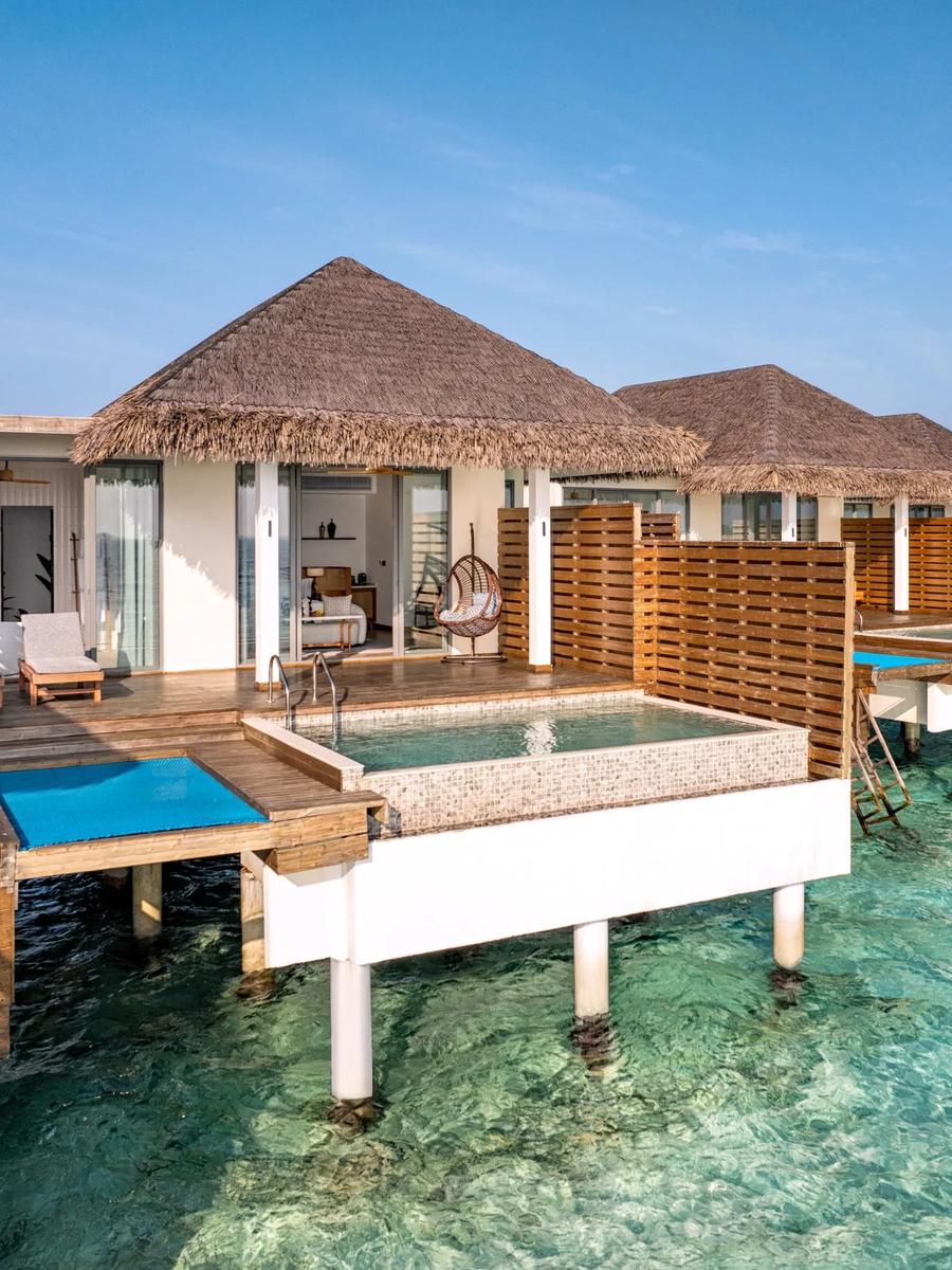 An Overwater Pool Villa at dusitD2 Feydhoo Maldives — a dedicated photograph of the sunset-facing Premium Overwater Pool Villa wasn't published, so this near-identical overwater category stands in as the closest match
