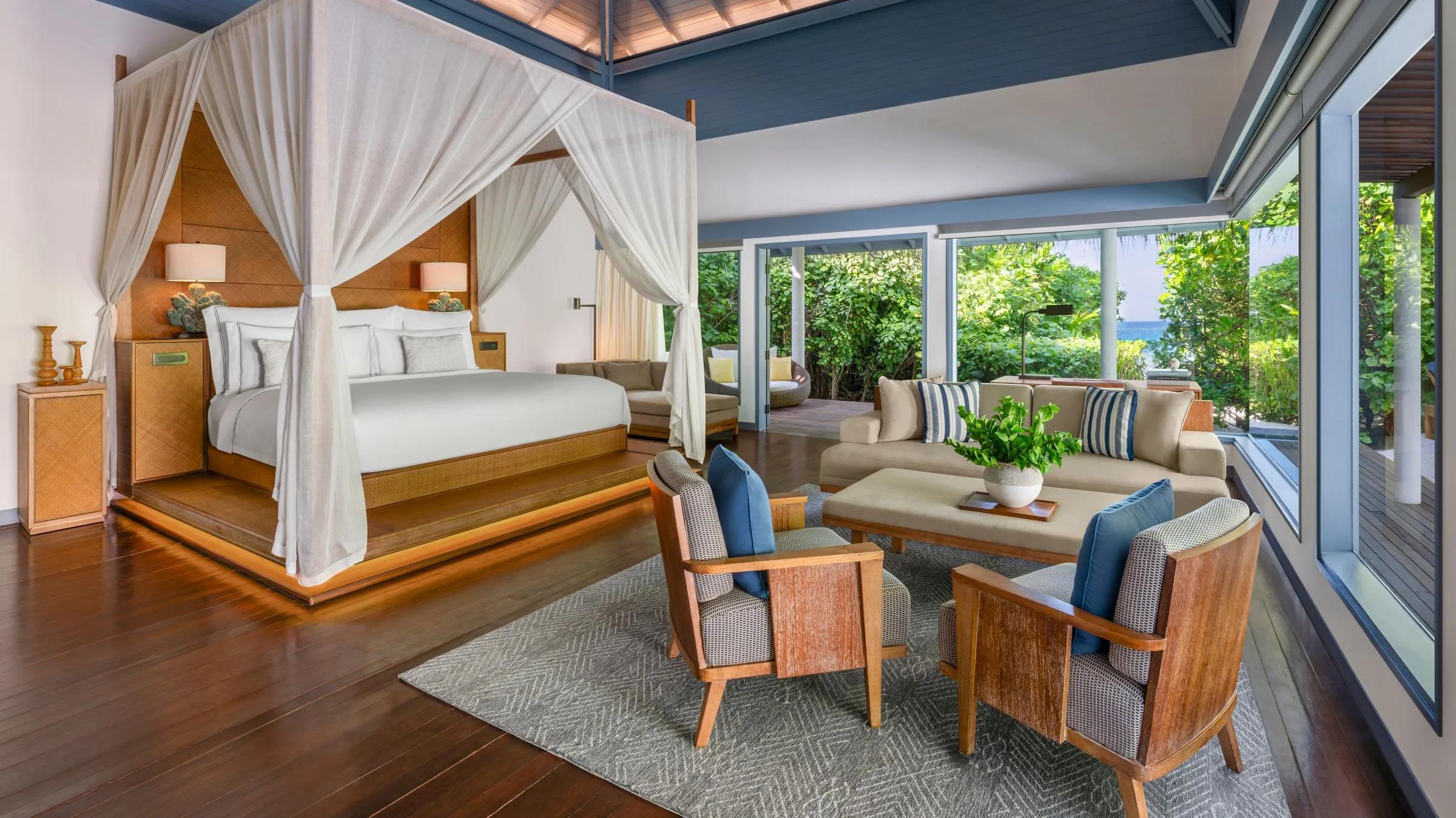 The bedroom of an Island Beach Villa, furnished with a king bed