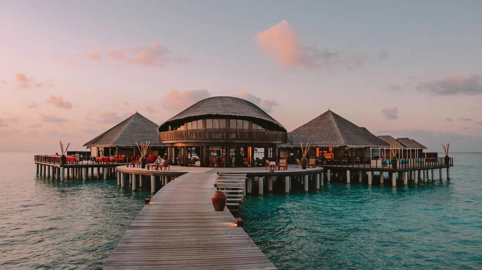 Stars, Coco Residence's two-storey overwater restaurant and bar, at dusk