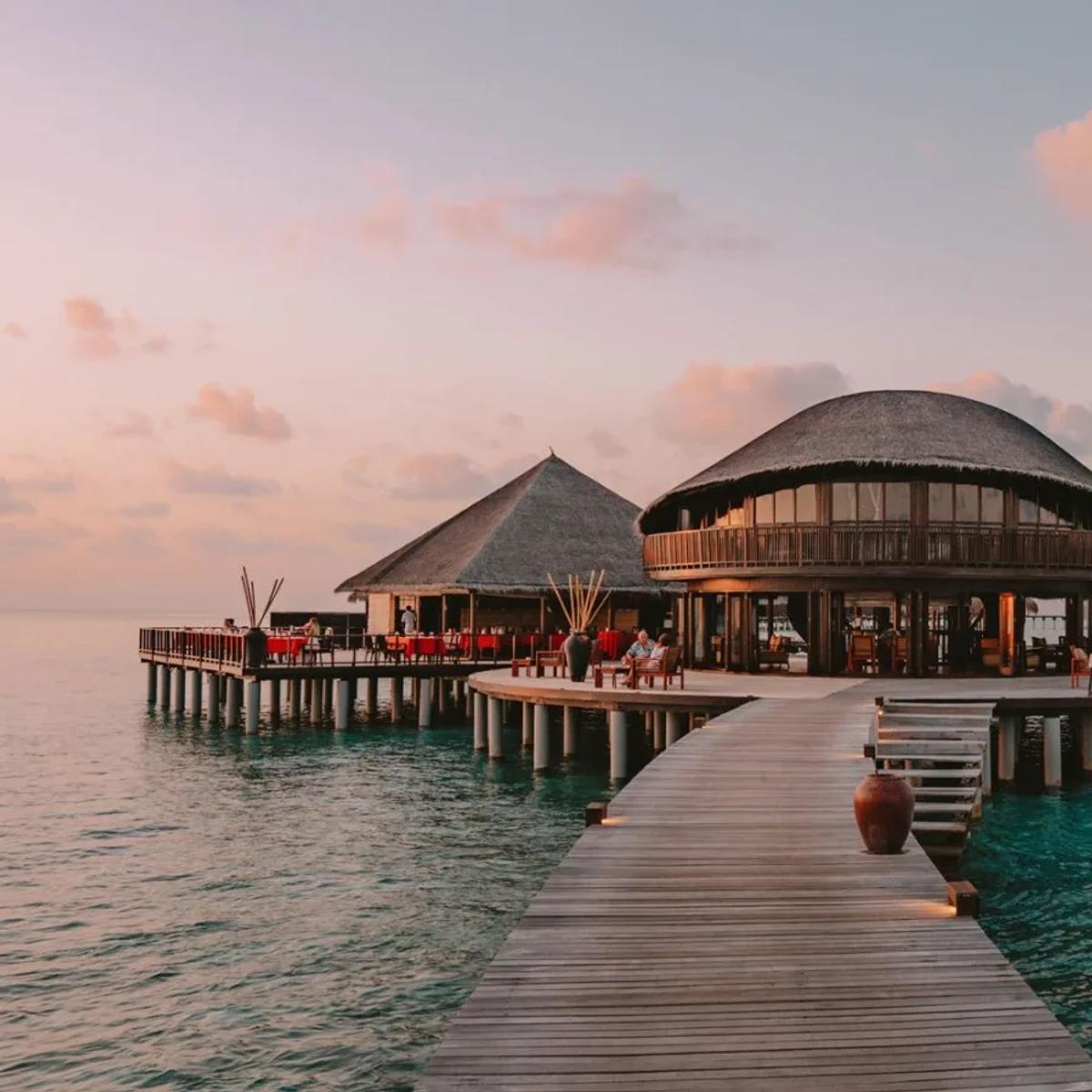 Stars, Coco Residence's two-storey overwater restaurant and bar, at dusk