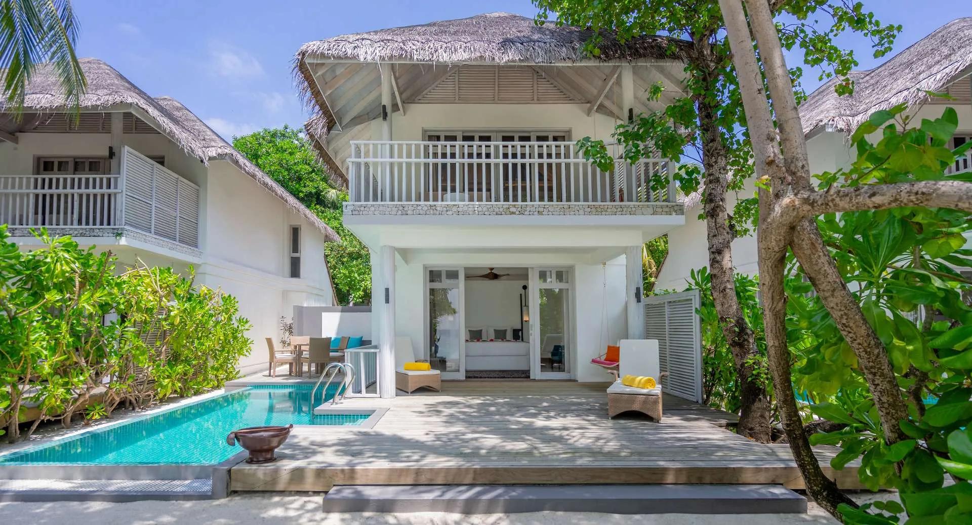 The two-storey exterior of a Two Bedroom Duplex Beach Villa with Private Pool, its ground-floor pool visible