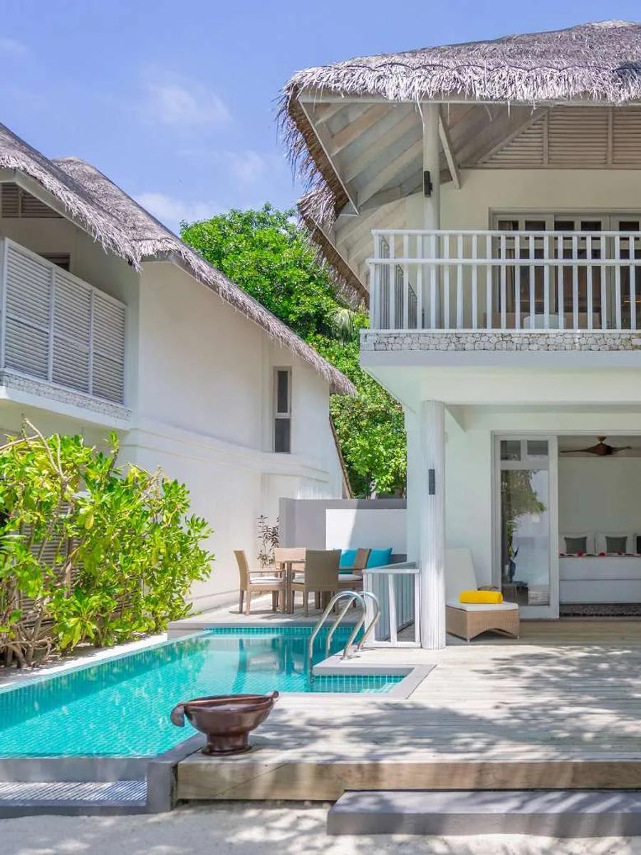The two-storey exterior of a Two Bedroom Duplex Beach Villa with Private Pool, its ground-floor pool visible
