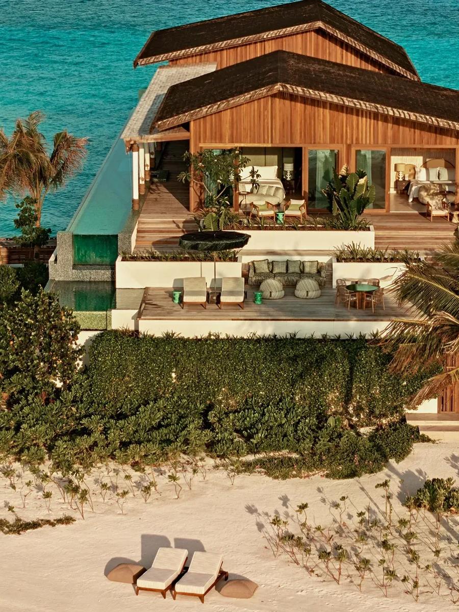 A four-bedroom Somewhere residence at .Here, its private sky pool running along the beachfront deck