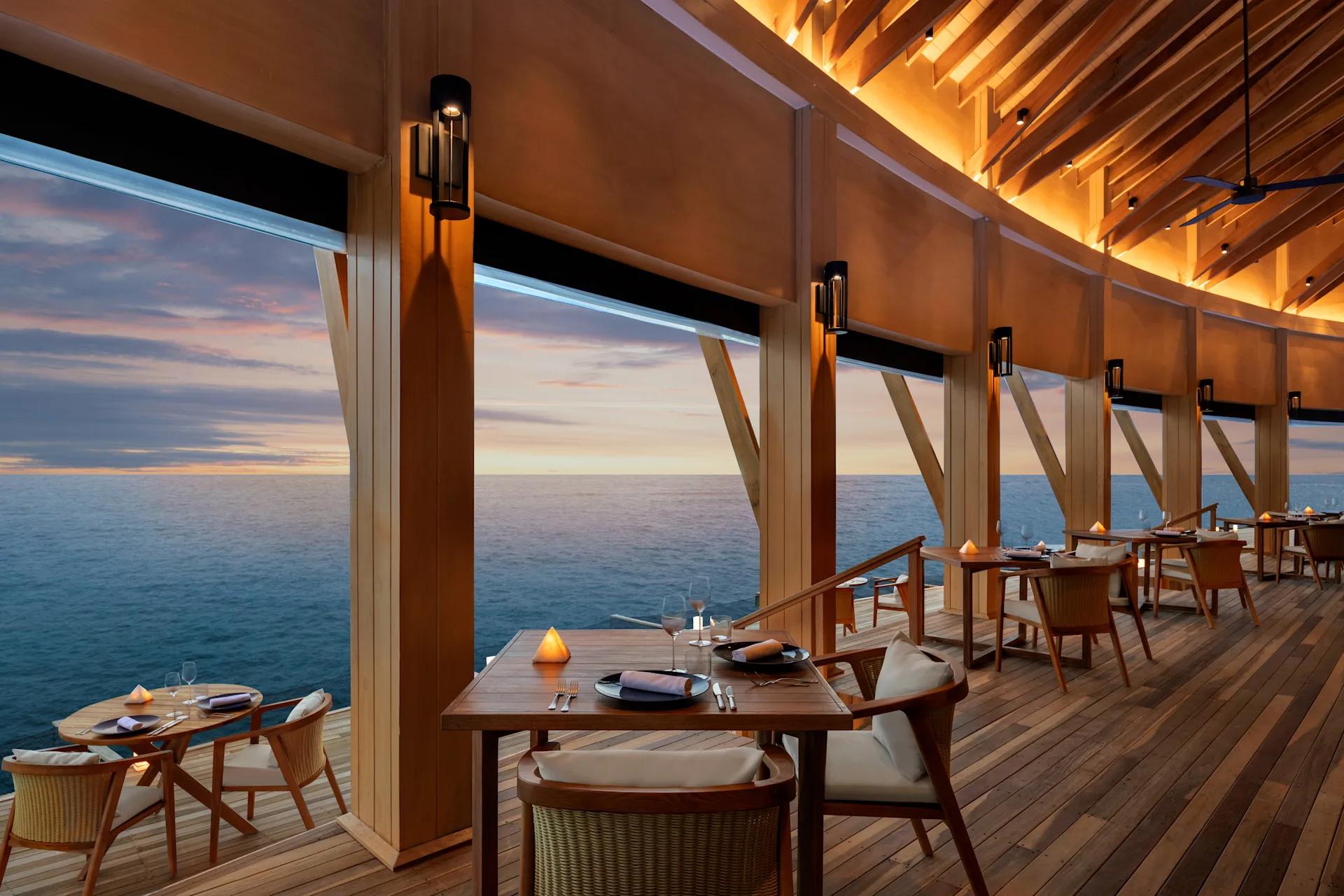 Origin, the resort's overwater fine-dining Italian restaurant, under open sky
