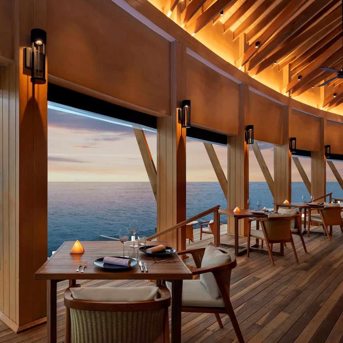 Origin, the resort's overwater fine-dining Italian restaurant, under open sky