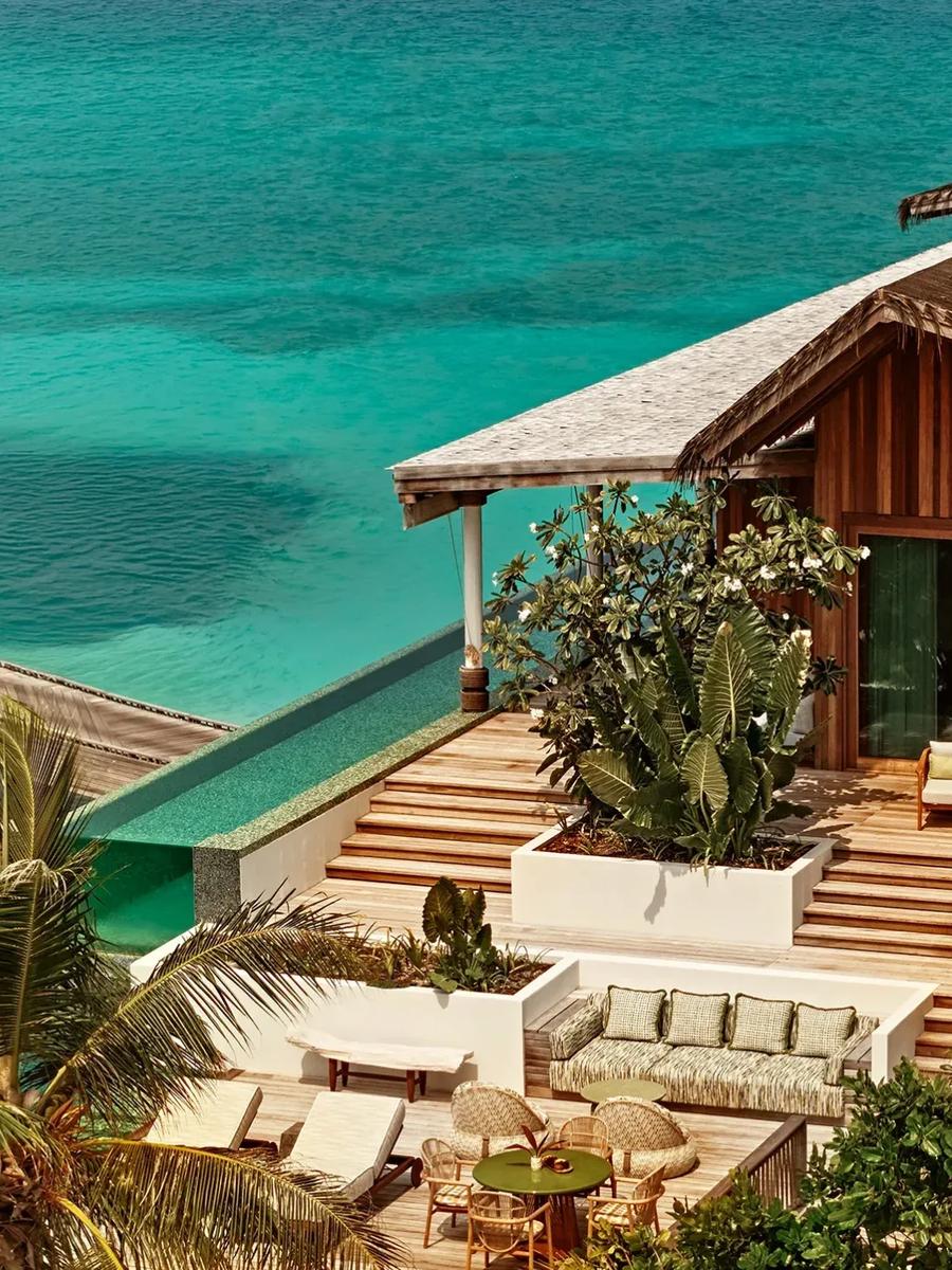 A 3-Bedroom Residence at .Here on Somewhere island, its double-aspect design facing both beach and lagoon