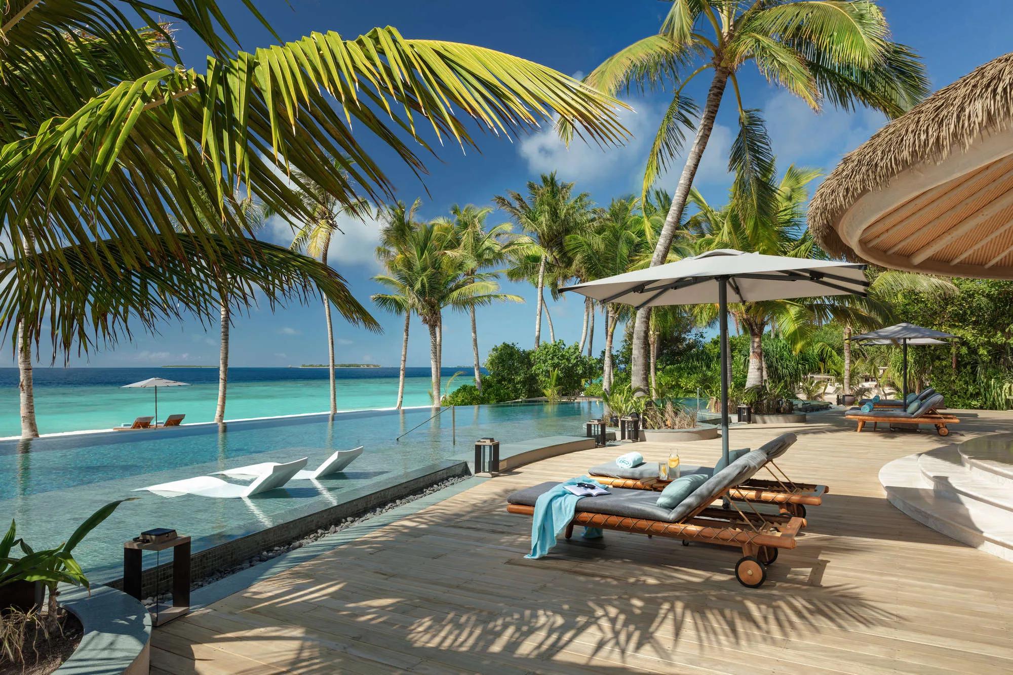 The three-layered poolside sundeck at MOJO, Joali Being's Mediterranean and global restaurant