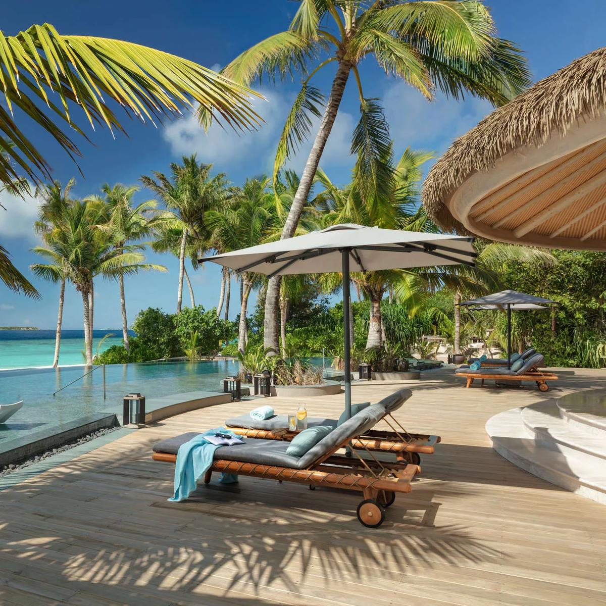 The three-layered poolside sundeck at MOJO, Joali Being's Mediterranean and global restaurant