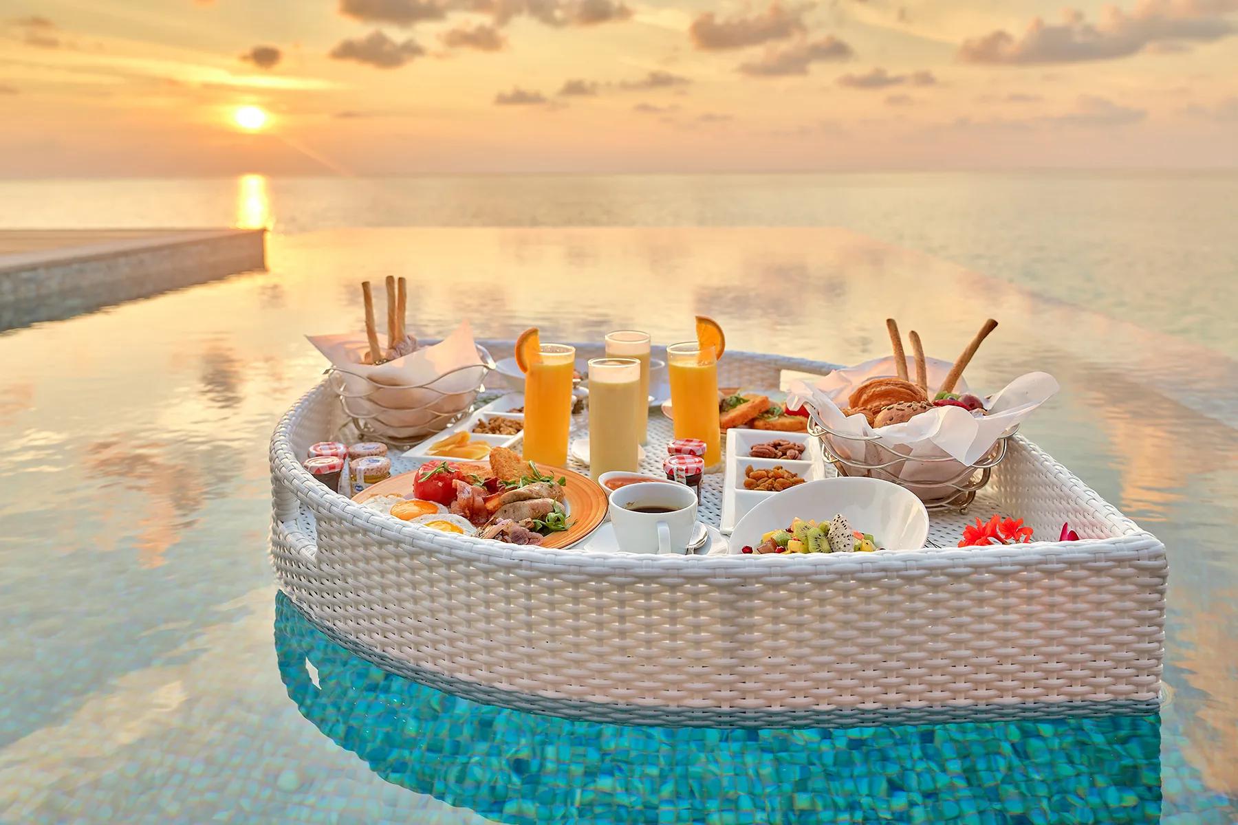 A floating breakfast tray set on a villa pool as part of the Destination Dining programme