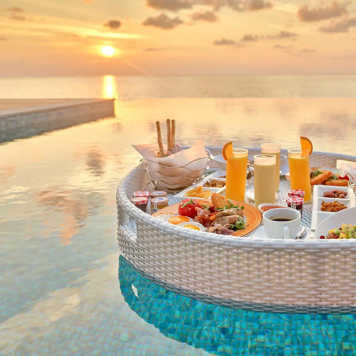 A floating breakfast tray set on a villa pool as part of the Destination Dining programme