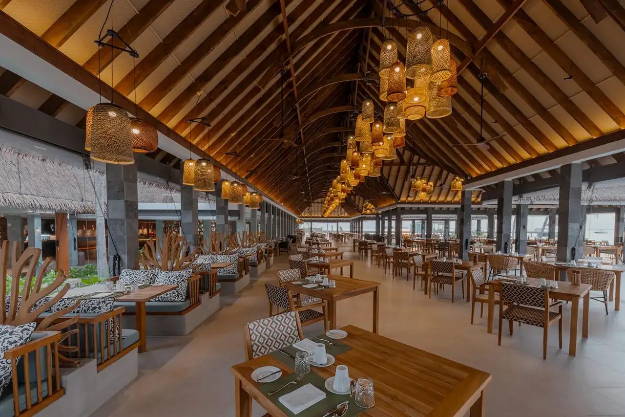 Fili's buffet dining room, set for service with the lagoon visible beyond