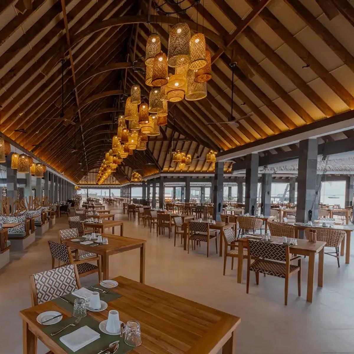 Fili's buffet dining room, set for service with the lagoon visible beyond