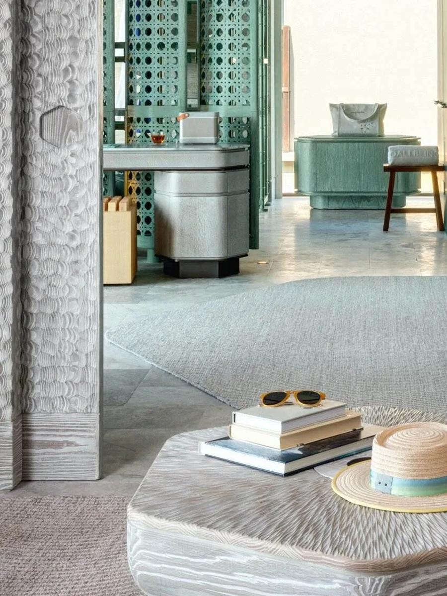 The living room of a Grand Ocean Pool Villa at Joali Being, opening onto the lagoon-facing sundeck