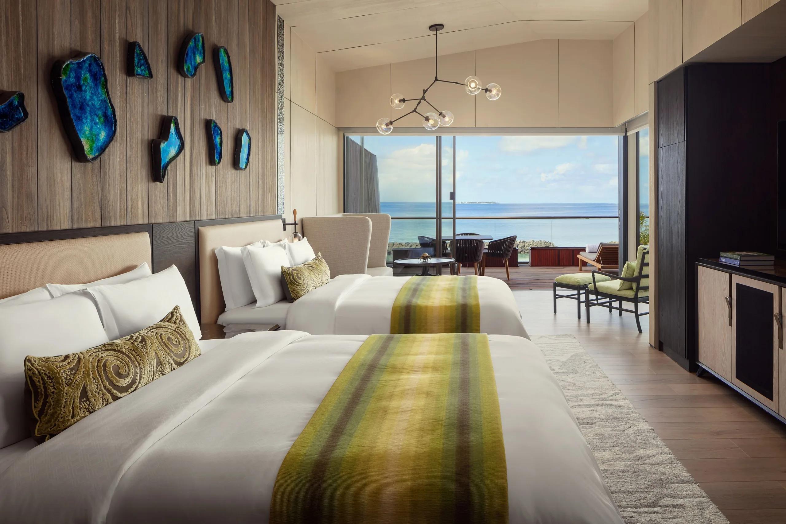 The bedroom of a Two Bedroom Sunset Villa at The St. Regis Maldives Vommuli Resort