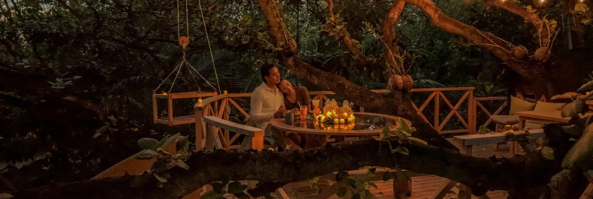 Kuri – Treehouse Dining at JA Manafaru, a private table built into a living tree at the island's edge