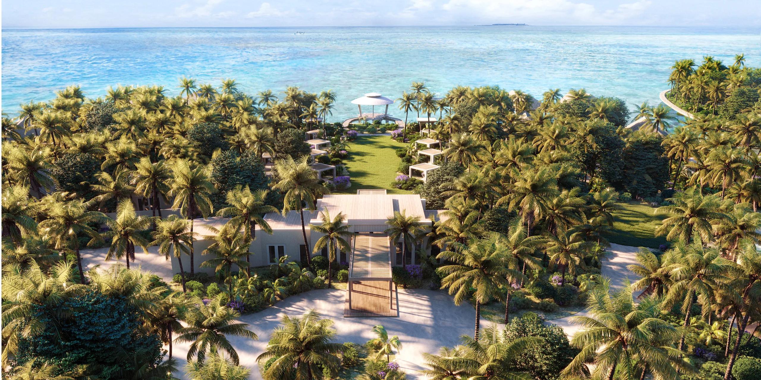 An elevated view of the Waldorf Astoria Spa at Ithaafushi, its palm-shaded walkway leading to an overwater pavilion