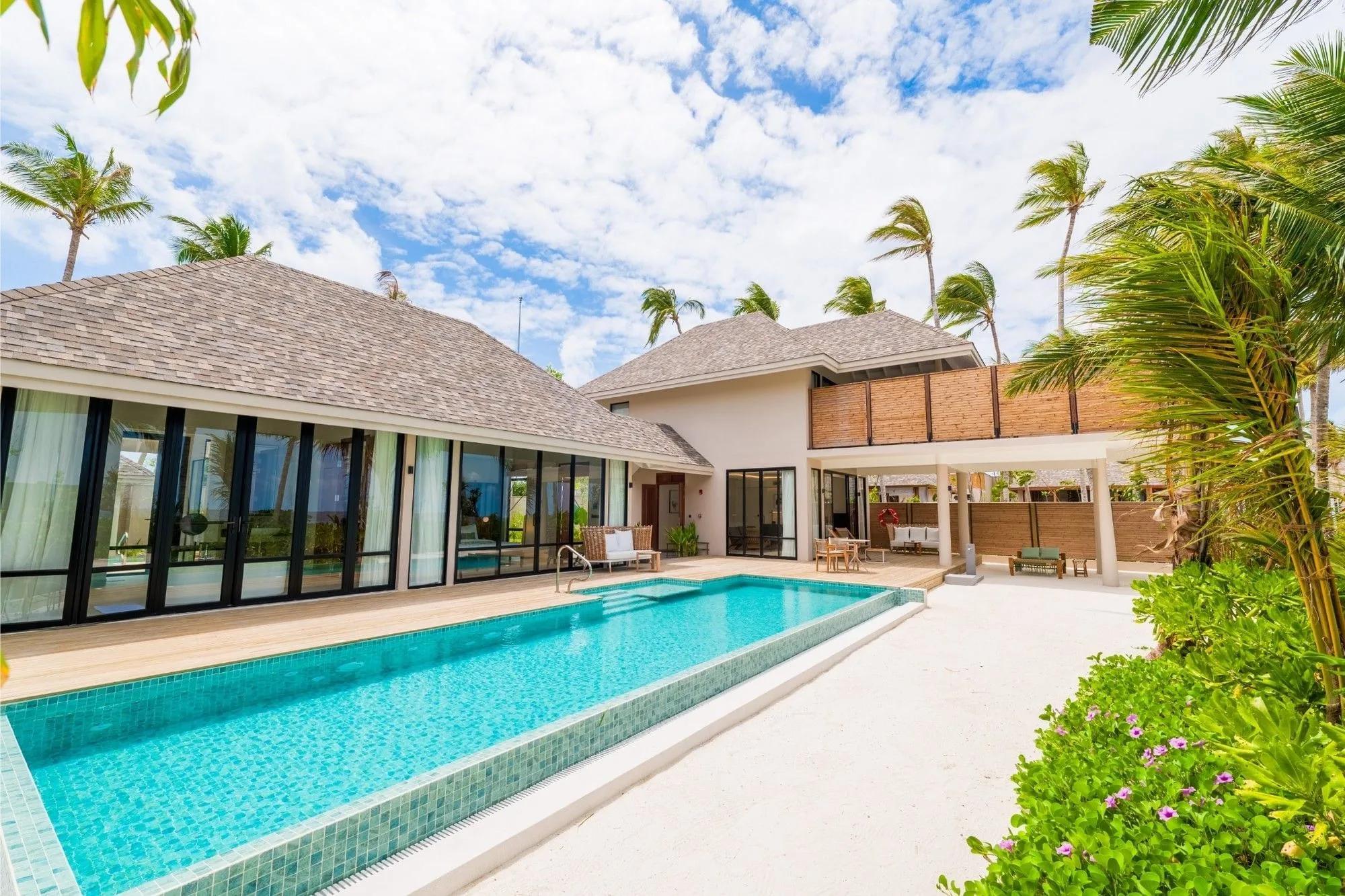 A large two-storey beach residence with private pool, representative of the 3-Bedroom Beach Residence category