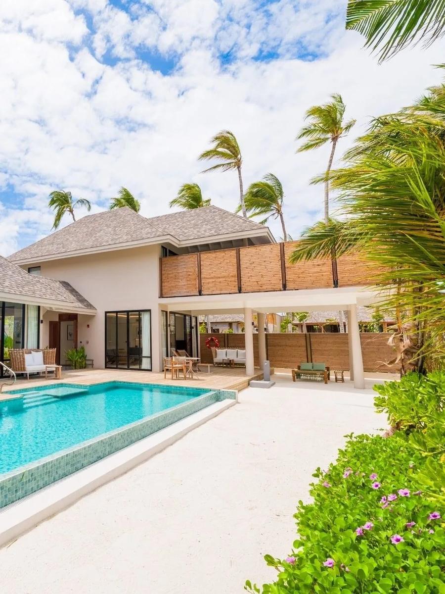 A large two-storey beach residence with private pool, representative of the 3-Bedroom Beach Residence category