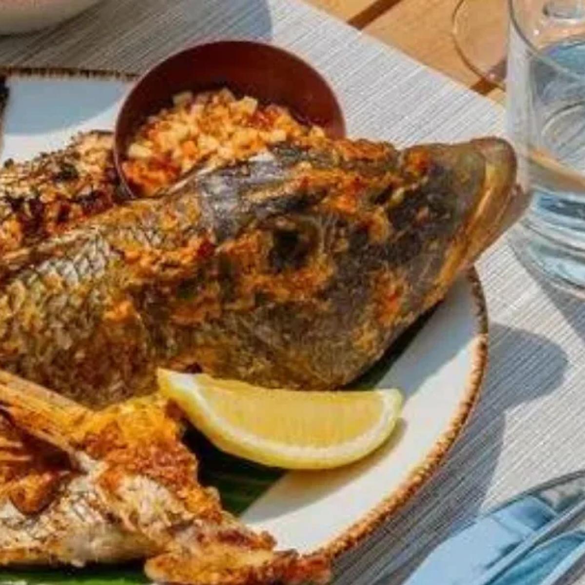 A whole grilled reef fish plated at Faru Restaurant