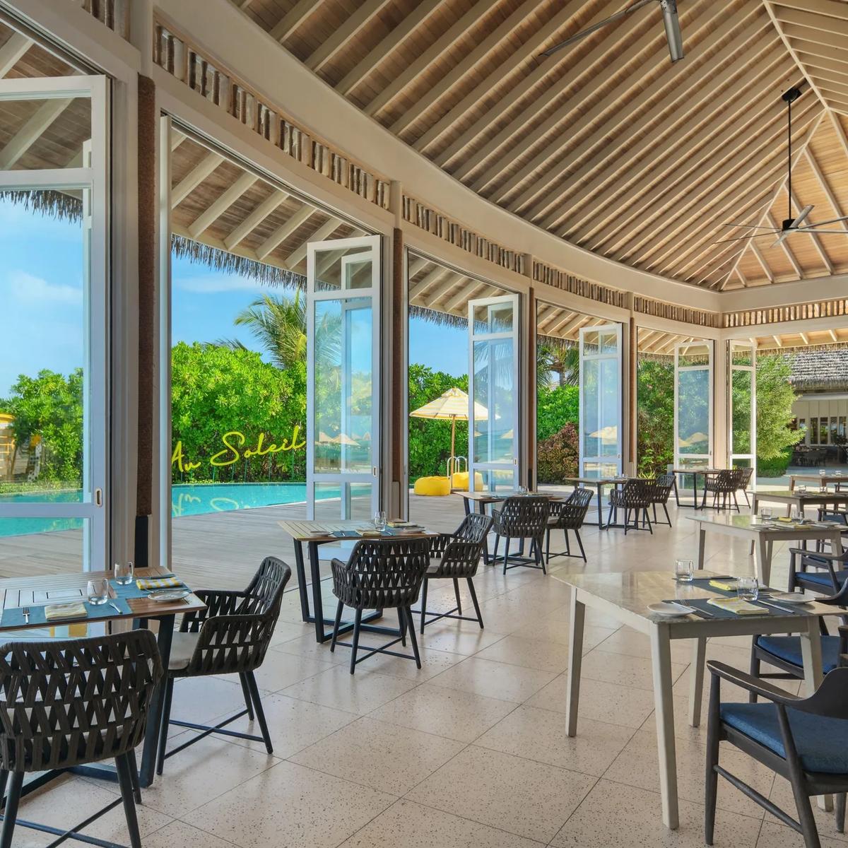 Velaa Bar + Grill's indoor seating with ocean views