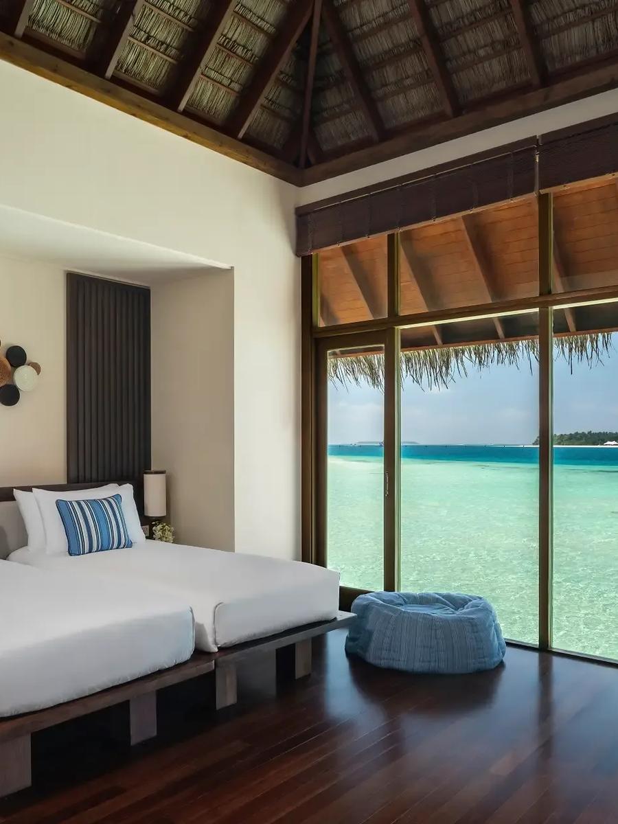 The second bedroom of a Two-Bedroom Grand Water Villa at Conrad Maldives Rangali, overlooking the lagoon