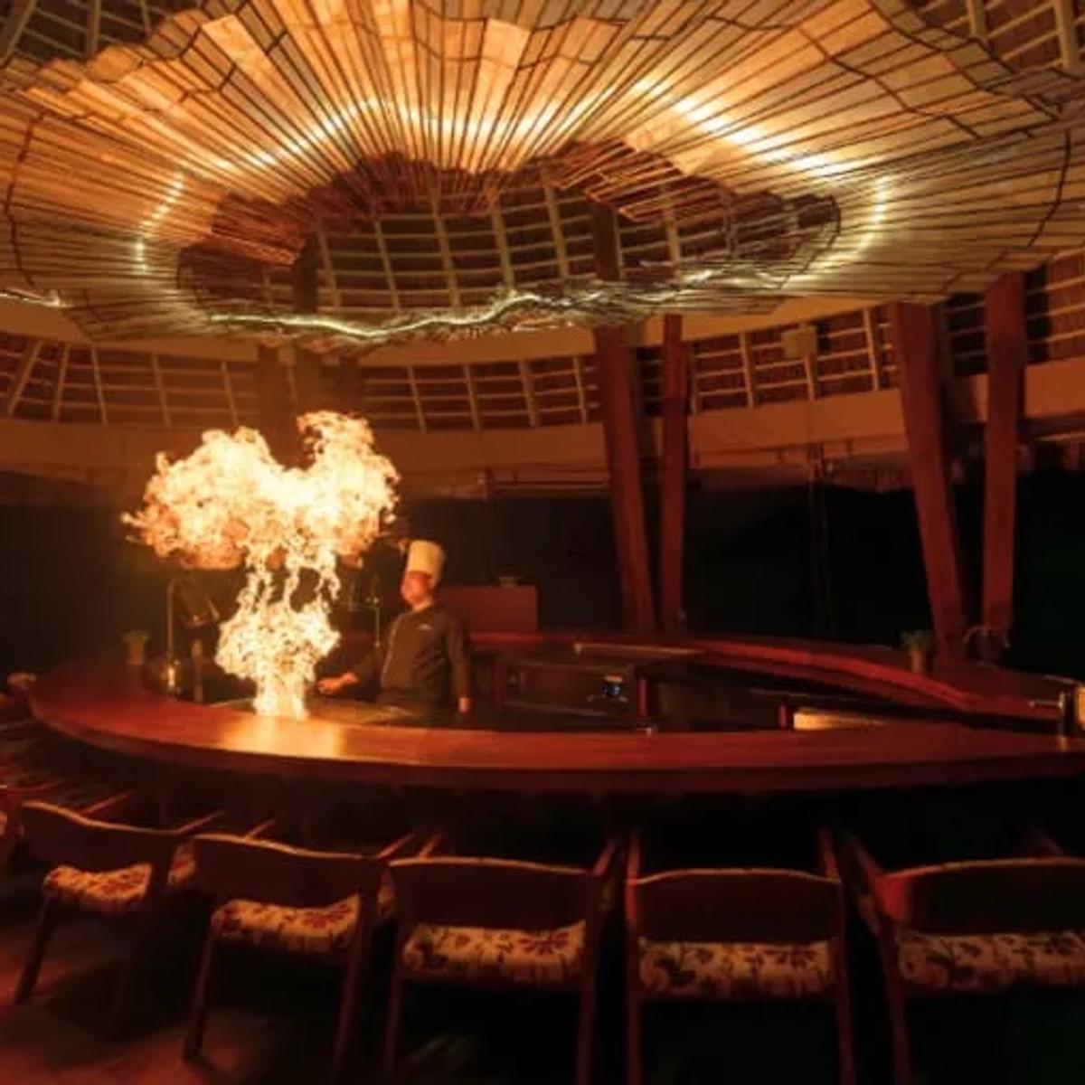 FIRE restaurant's overwater dining room at Anantara Kihavah Maldives Villas