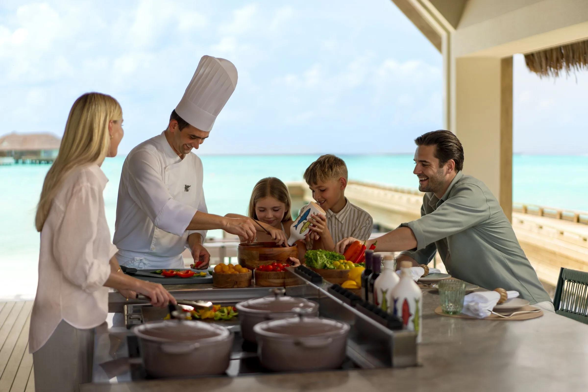 A chef at work using herbs and produce grown in the resort's own JW Garden