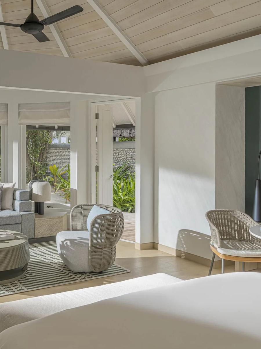 A Sunset Family Beach Villa's living room, opening onto the pool deck and lagoon