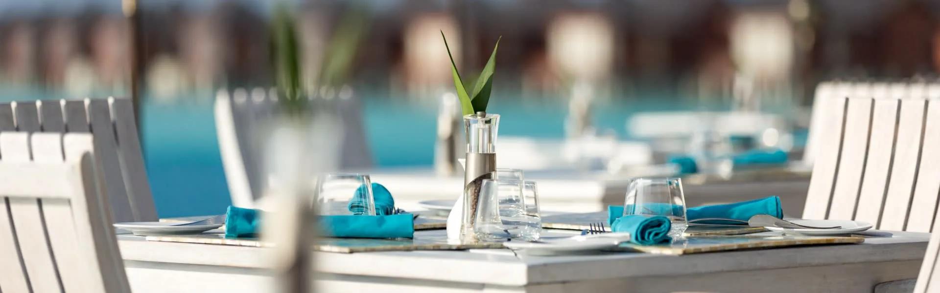 A table set for a meal at Sea.Fire.Salt., overlooking the lagoon