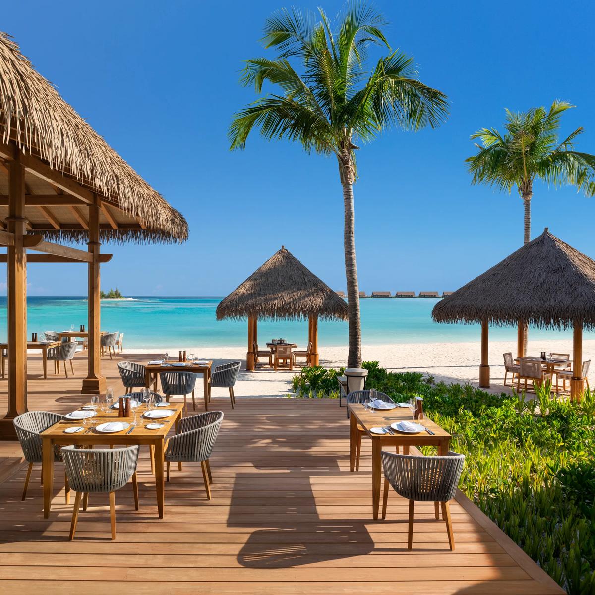 The beachfront dining room at Tasting Table, Waldorf Astoria Maldives Ithaafushi's all-day restaurant
