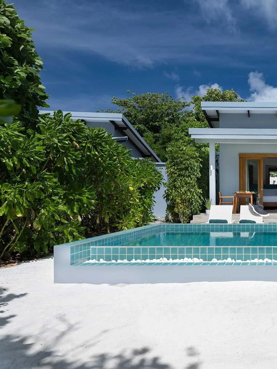 The exterior and private pool of a Sunset Beach Villa with Pool at Ifuru Island Maldives