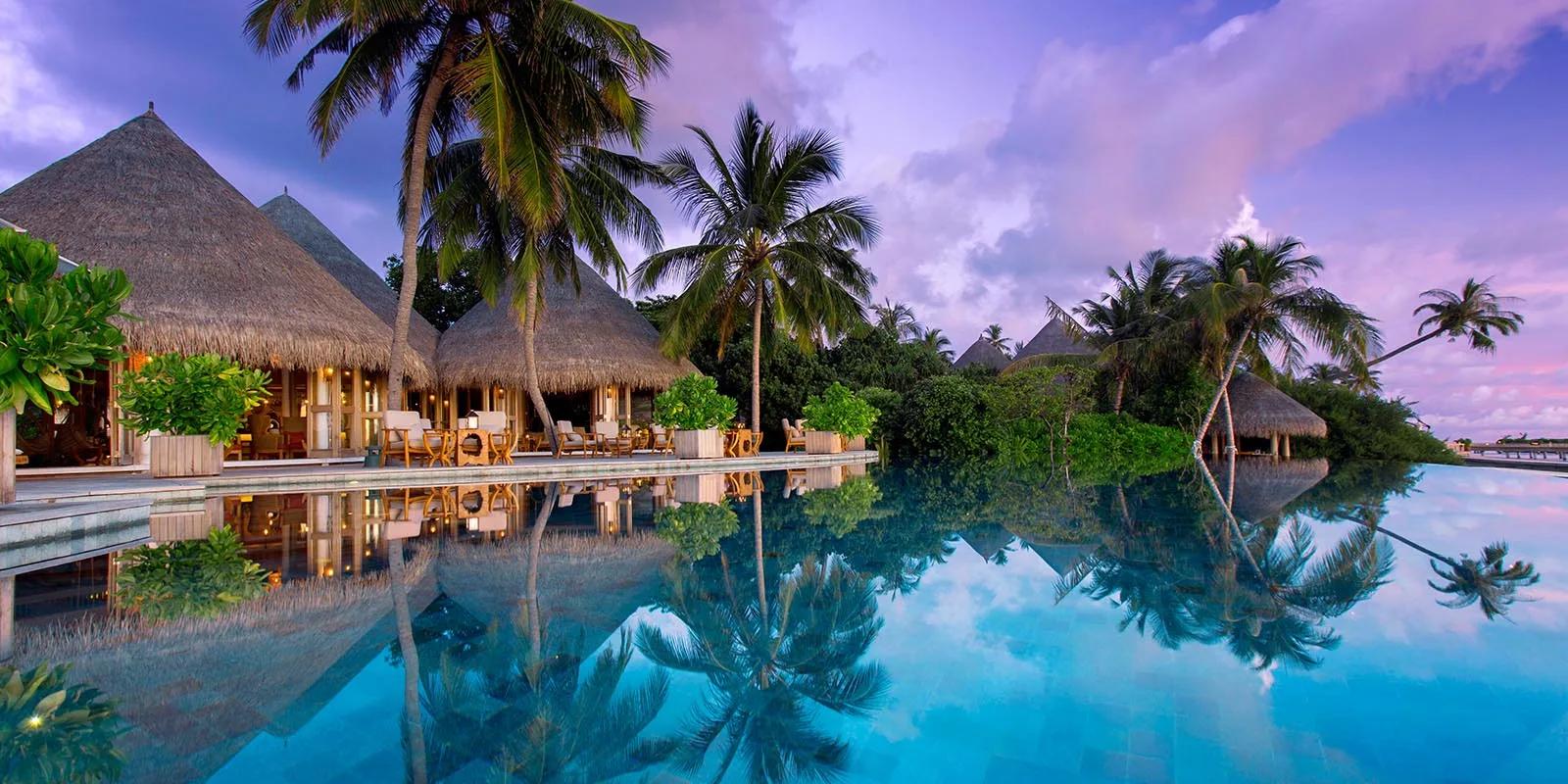 Compass Pool Bar at Milaidhoo, beside the resort's infinity pool.
