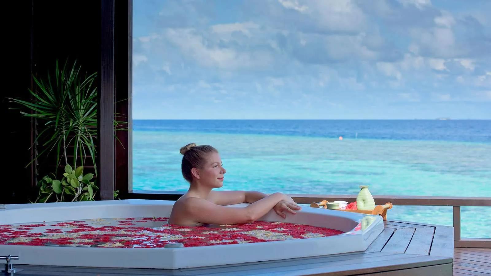 A treatment room with a jacuzzi at Tamara Spa, Lily Beach Resort & Spa