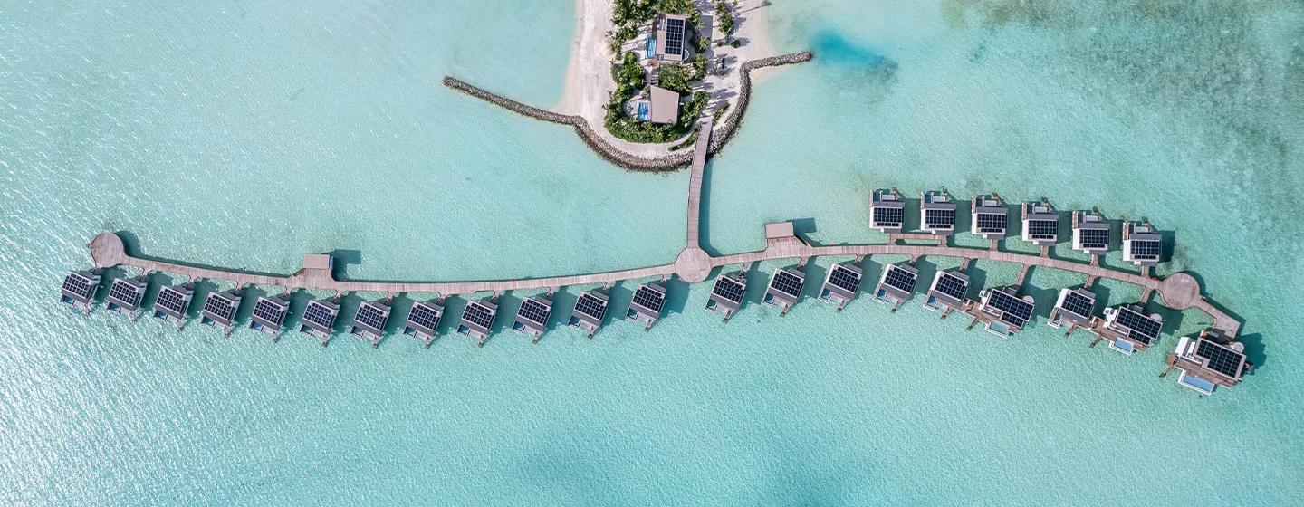 Aerial view of SO/ Maldives' overwater villa jetties by day — representative of the Three-Bedroom Ocean Water Pool Atelier; a dedicated photograph was not available